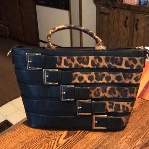 Large purse with buckles n tiger bands around it